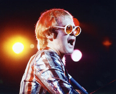 Elton John merchandise including signed posters and apparel for fans