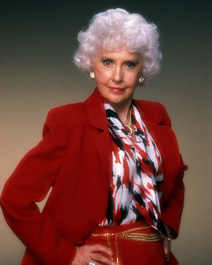 Barbara Stanwyck in a classic film scene, showcasing her dramatic talent.