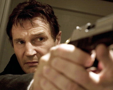 Liam Neeson in an action-packed scene from a thriller