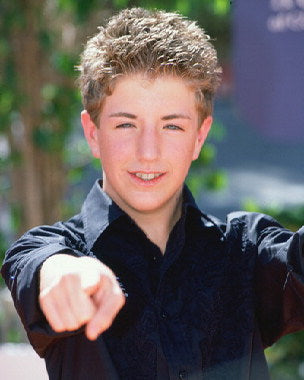 Billy Gilman performing live on stage at a concert