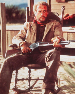 Cover of Judge Roy Bean movie featuring Paul Newman in a western setting.