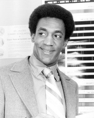 Bill Cosby performing his stand-up comedy on stage