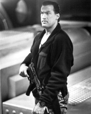 Front view of the Under Siege poster featuring Steven Seagal's silhouette in action pose