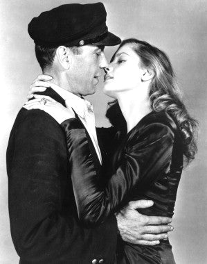 To Have and Have Not movie poster featuring Humphrey Bogart and Lauren Bacall in a romantic scene.