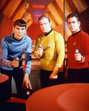 Star Trek action figures displayed on a shelf, perfect for collectors.