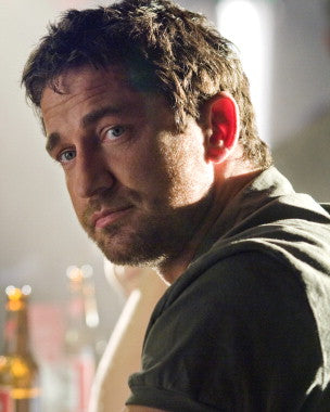 Gerard Butler in an intense action scene from a blockbuster film.