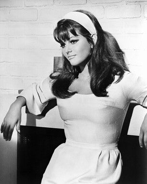 Elegant Claudia Cardinale vintage dress featuring classic Italian style.