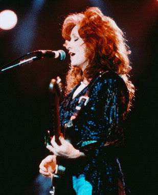 Bonnie Raitt live concert performance capturing her energetic presence.