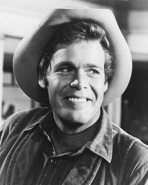 Doug McClure in a classic scene from The Virginian series, showcasing the rugged charm of western movies.