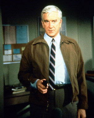 Leslie Nielsen laughing in a classic comedy scene