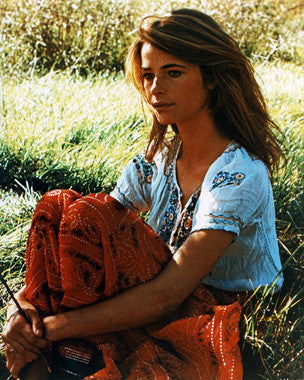 Elegant Charlotte Rampling designer dress showcased on a model at a fashion event.