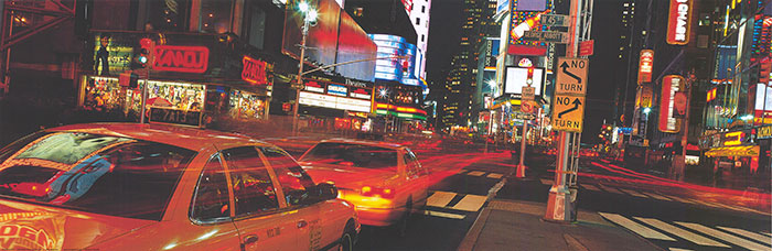 A bustling Times Square at night, showcasing bright lights and crowds.