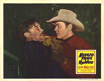 Allan Lane in a scene from Navajo Trail Raiders, showcasing the action and adventure of classic cowboy films.