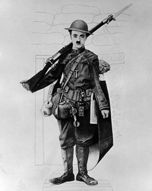 Close-up of a vintage Charlie Chaplin poster with iconic imagery