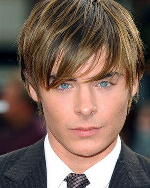Zac Efron collectible merchandise displayed in a stylish arrangement.