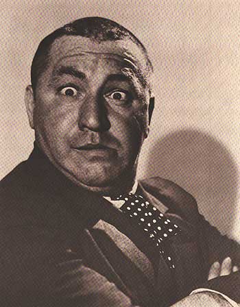 Front view of Curly Howard collectible figurine with vintage finish