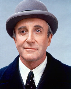 Close-up of an autographed Peter Sellers photo showcasing his iconic smile.