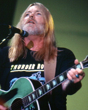 Close-up of Gregg Allman autographed guitar showcasing the signature.