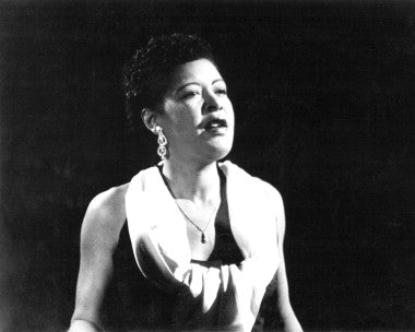 Close-up of a Billie Holiday vinyl record on a turntable, showcasing the album cover and vintage style