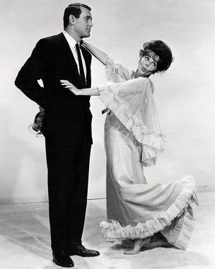 Rock Hudson and Leslie Caron in a classic romantic scene from the film collection.