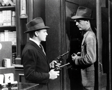 James Cagney in a classic film noir scene, showcasing his iconic acting style.