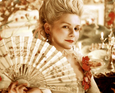 Close-up of a Kirsten Dunst poster featuring her signature smile, ideal for fans.