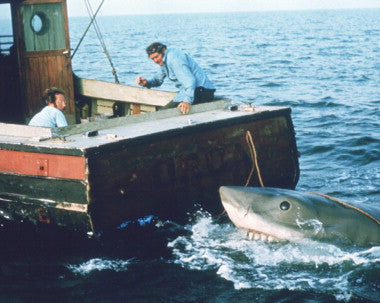 Jaws movie poster with shark and ocean background, ideal for horror film enthusiasts
