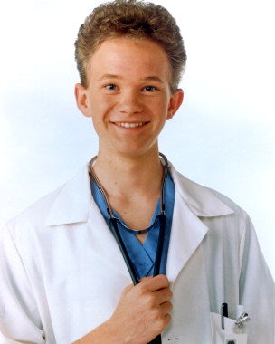 Neil Patrick Harris in a scene from Doogie Howser, showcasing his youthful charm and extraordinary talent as a teenage doctor.