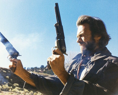 Clint Eastwood riding through the Western desert in Outlaw Josey Wales DVD cover