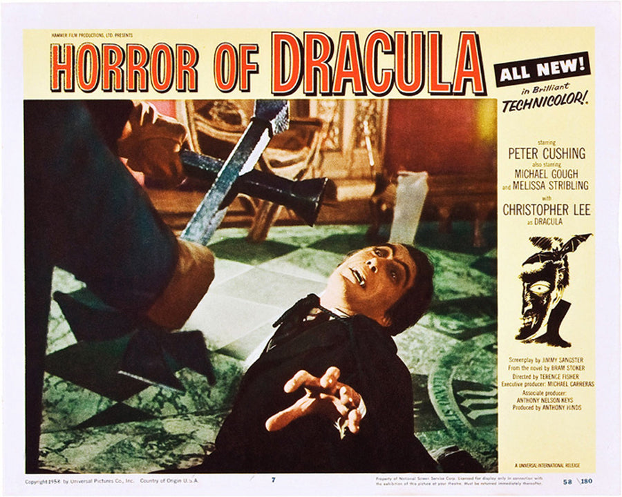 Framed Dracula poster displayed in a vintage-style home theater setup as classic horror decor