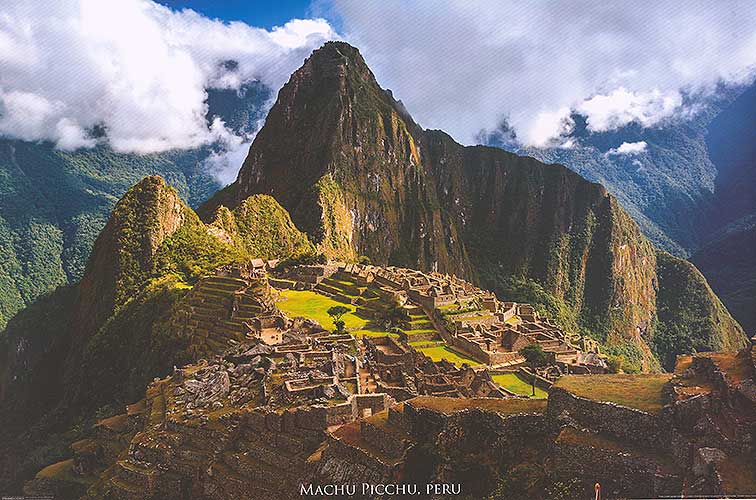 A breathtaking view of Machu Picchu at sunrise, showcasing the ancient ruins surrounded by lush greenery.