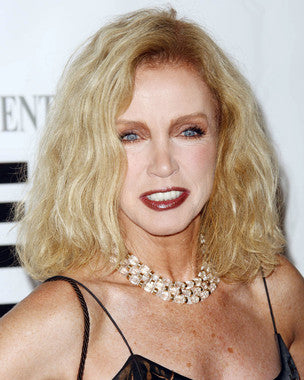 Close-up of Donna Mills anti-aging moisturizer jar showing rich texture