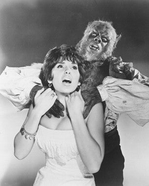 Curse of the Werewolf film poster featuring Oliver Reed