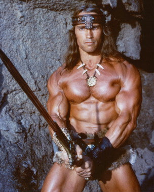 Arnold Schwarzenegger performing a bicep curl with gym equipment