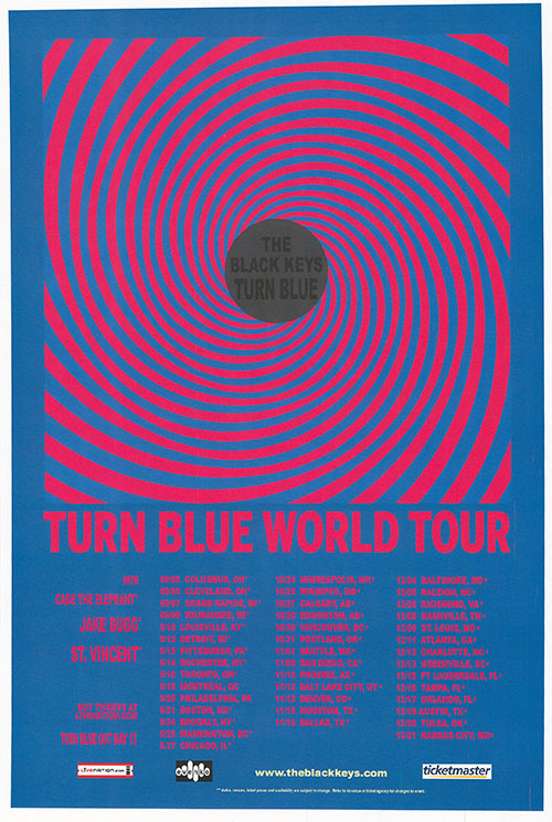 The Black Keys performing live on stage during their North America Tour, showcasing their electrifying energy.