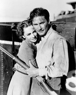 Dodge City movie poster showcasing Errol Flynn and Olivia de Havilland in Western costumes