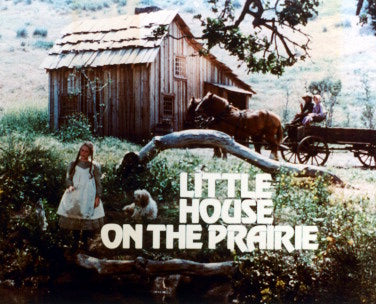 Cover of Little House on the Prairie book showcasing the Ingalls family's prairie life.