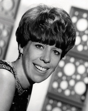 Carol Burnett performing a comedy sketch on her TV special stage