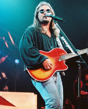 Travis Tritt concert merchandise featuring his iconic logo