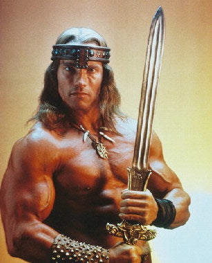 Arnold Schwarzenegger as Conan in a fierce battle scene from Conan the Barbarian