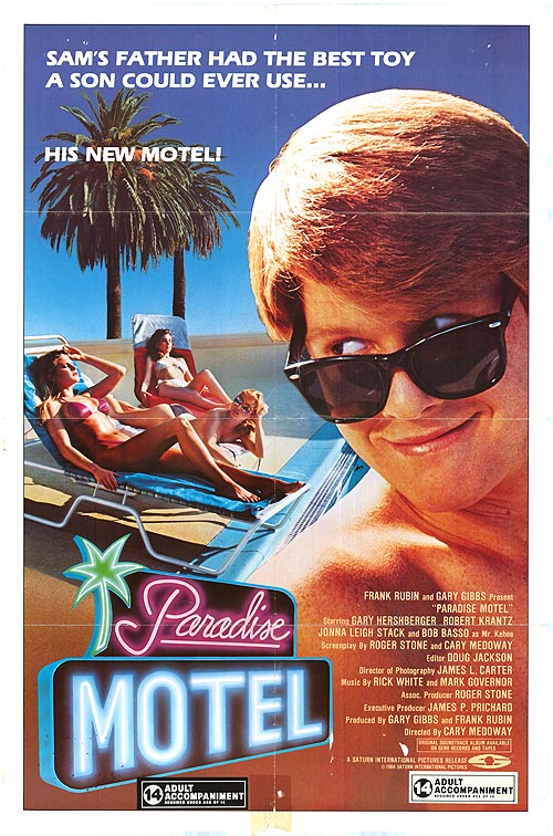 Paradise Motel exterior with pool and lush landscaping