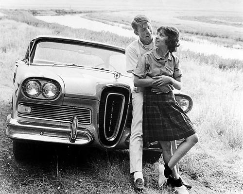 A vibrant American Graffiti movie poster showcasing classic car culture