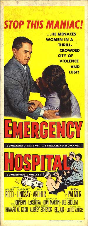 Emergency hospital staff attending to a patient in an emergency room