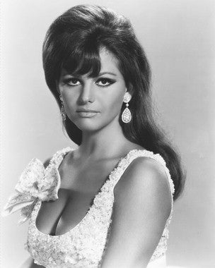 Close-up of a vintage Claudia Cardinale movie poster highlighting her timeless elegance