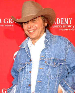 Dwight Yoakam vinyl records for sale displayed on a shelf, showcasing top country music albums.