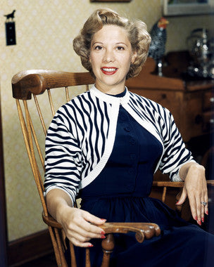 Dinah Shore performing live with a big band, capturing the essence of vintage jazz music.