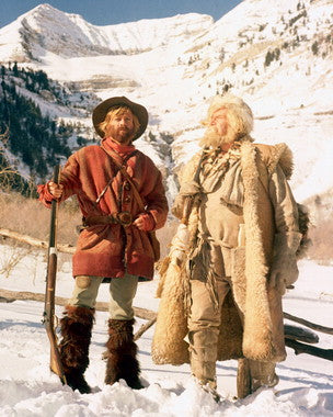 Jeremiah Johnson movie poster showing Robert Redford against a backdrop of mountains.