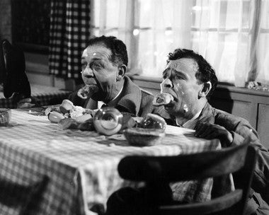 Scene from Carry On Cabby featuring Sid James in a comedic moment.