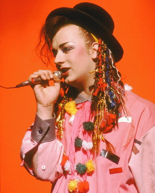Boy George-inspired makeup kit with colorful cosmetics and accessories
