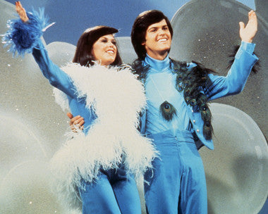 Donny Osmond and Marie Osmond performing live at their concert, showcasing their incredible chemistry and vocal harmony.